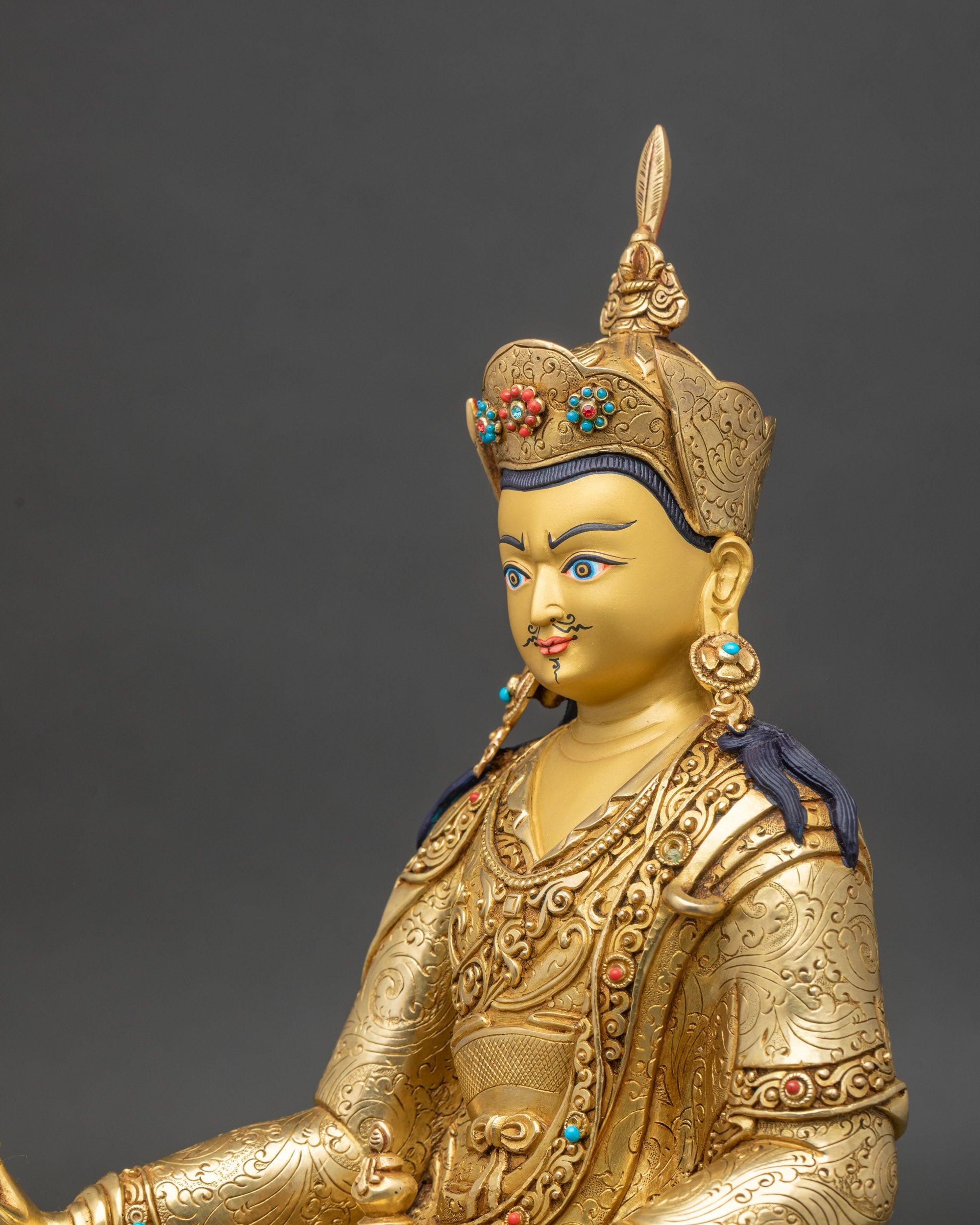 Side close-up of Guru Padmasambhava Statue highlighting ornate lotus pedestal and flowing robes