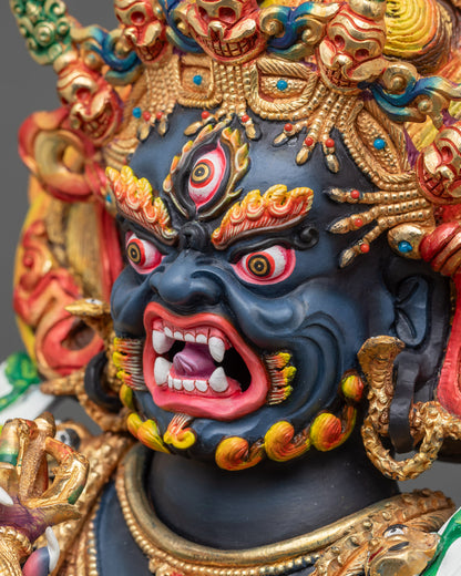 Side close-up of Mahakala face showing wrathful expression and hand-painted acrylic details
