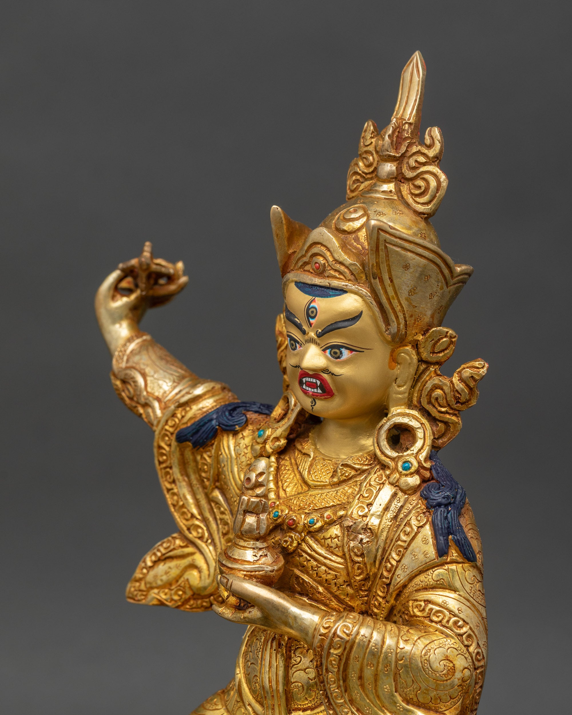 Side close-up of Standing Guru Rinpoche statue – Intricate gold fire-gilded copper detailing by Nepali artisans