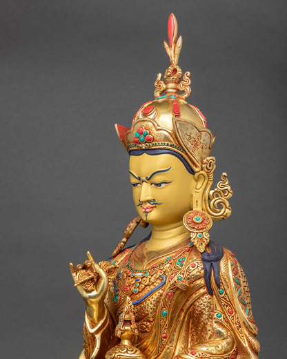 Side close-up of Tsokye Dorje Statue showing lotus hat, vulture feather, and ritual implements