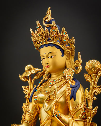 Side close-up of handcrafted Green Tara statue showing detailed 3D carvings and gold-gilded copper craftsmanship