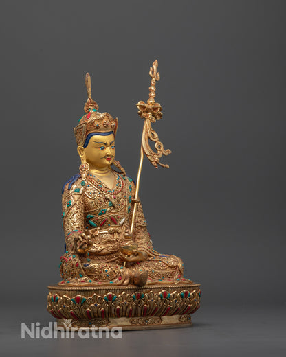 Side close-up showing detailed craftsmanship and radiant gold finish on Guru Rinpoche Statue