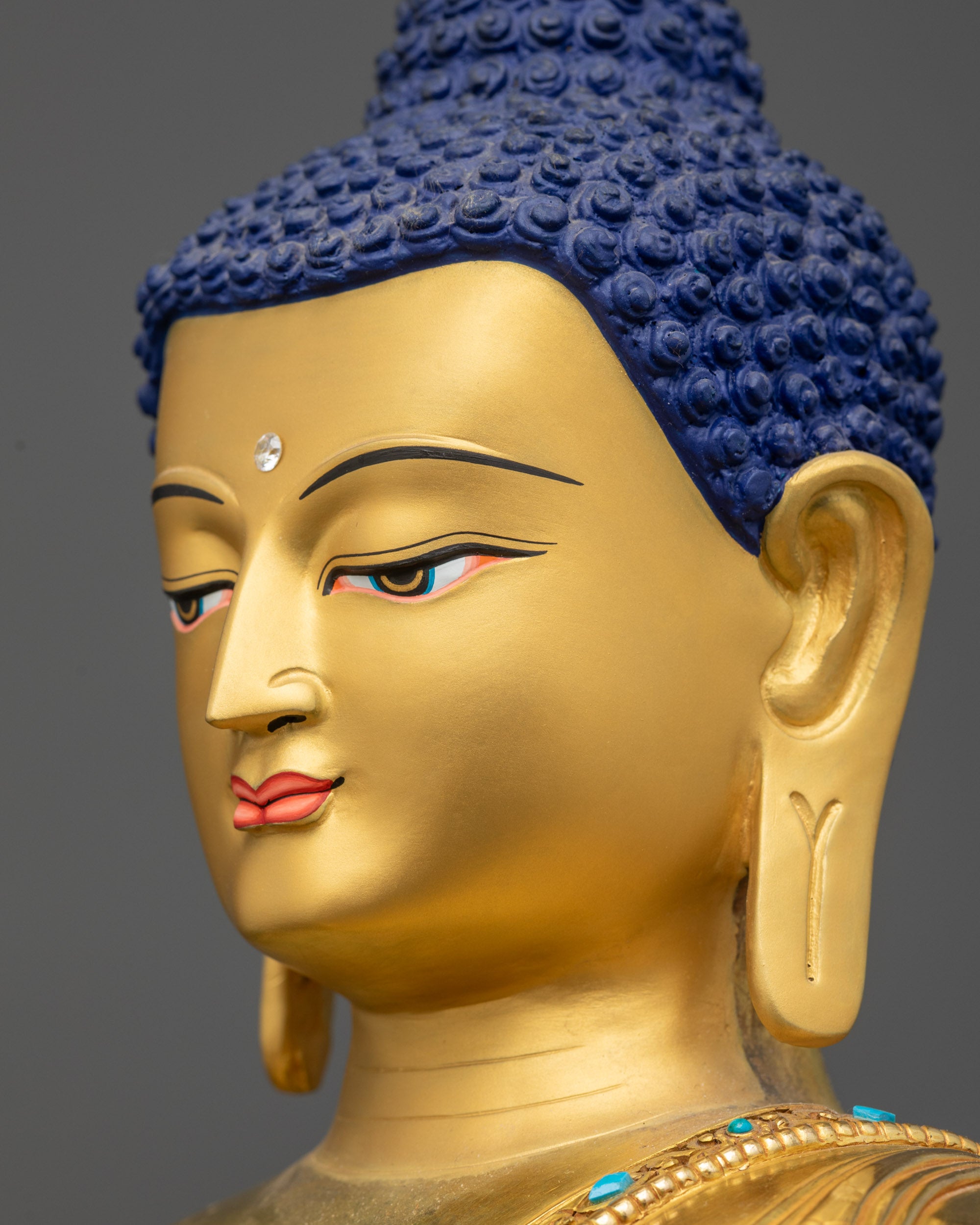 Side close up face of Vairocana Buddha displaying calm Dharmachakra Mudra