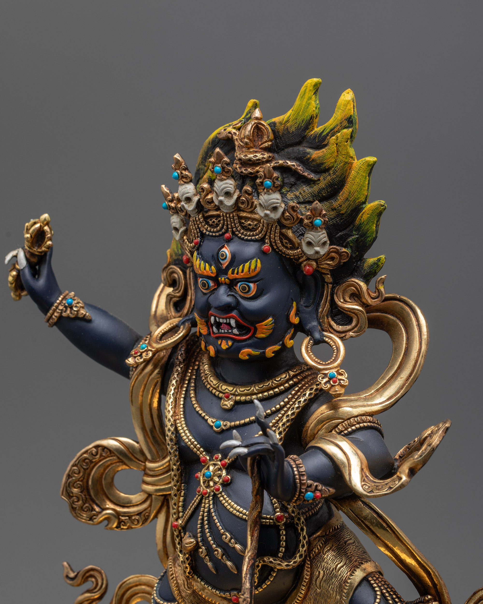 Side close up face of Vajrapani Buddhist deity showing intricate patterns
