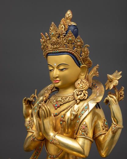 Side close up of Chenrezig Statue showing swirling robe and patterned lower garments
