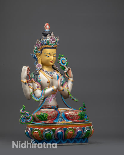 Side close up of Chenrezig gold-gilded face and lotus blossom in hand