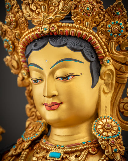 Side close up of Green Tara face with crown and flowing robes visible
