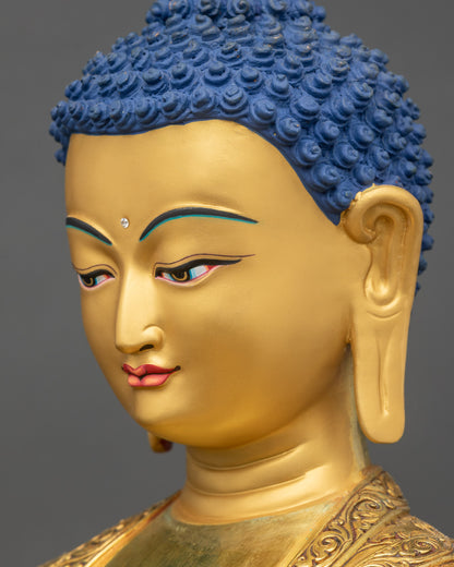Side close up of Shakyamuni Buddha serene gold-gilded face