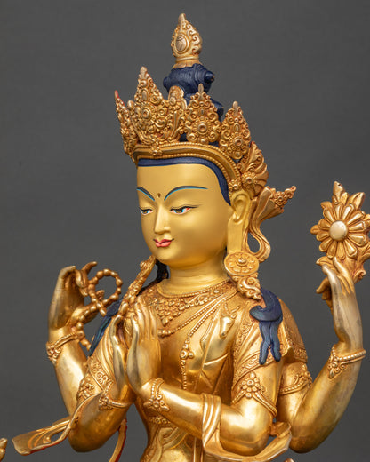 Side detail of Chenrezig statue showing swirling robes and ornate jewelry