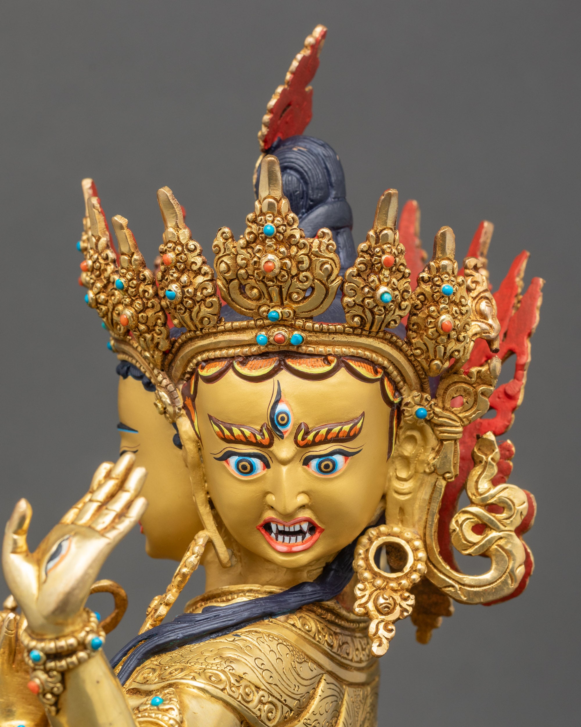 Side detail of Nepalese Namgyalma sculpture showing semi-precious stone inlay and intricate carving