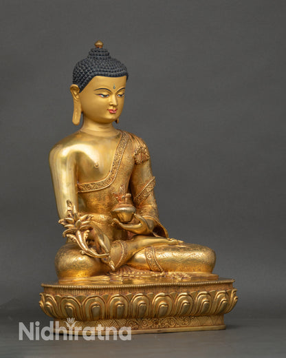 Side detail of copper and gold 3D carvings on Tibetan Healing Buddha statue