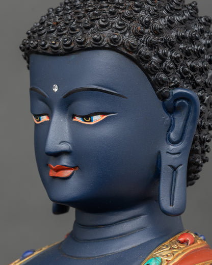 Side face close-up of Bhaisajyaguru statue, detailed gold fire-gilded features and serene expression
