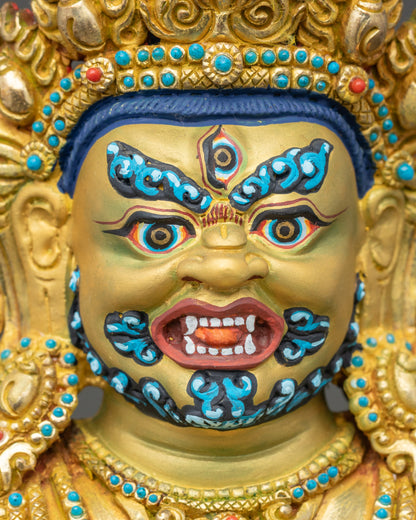 Side face close-up of Black Dzambhala deity showing gold-painted features
