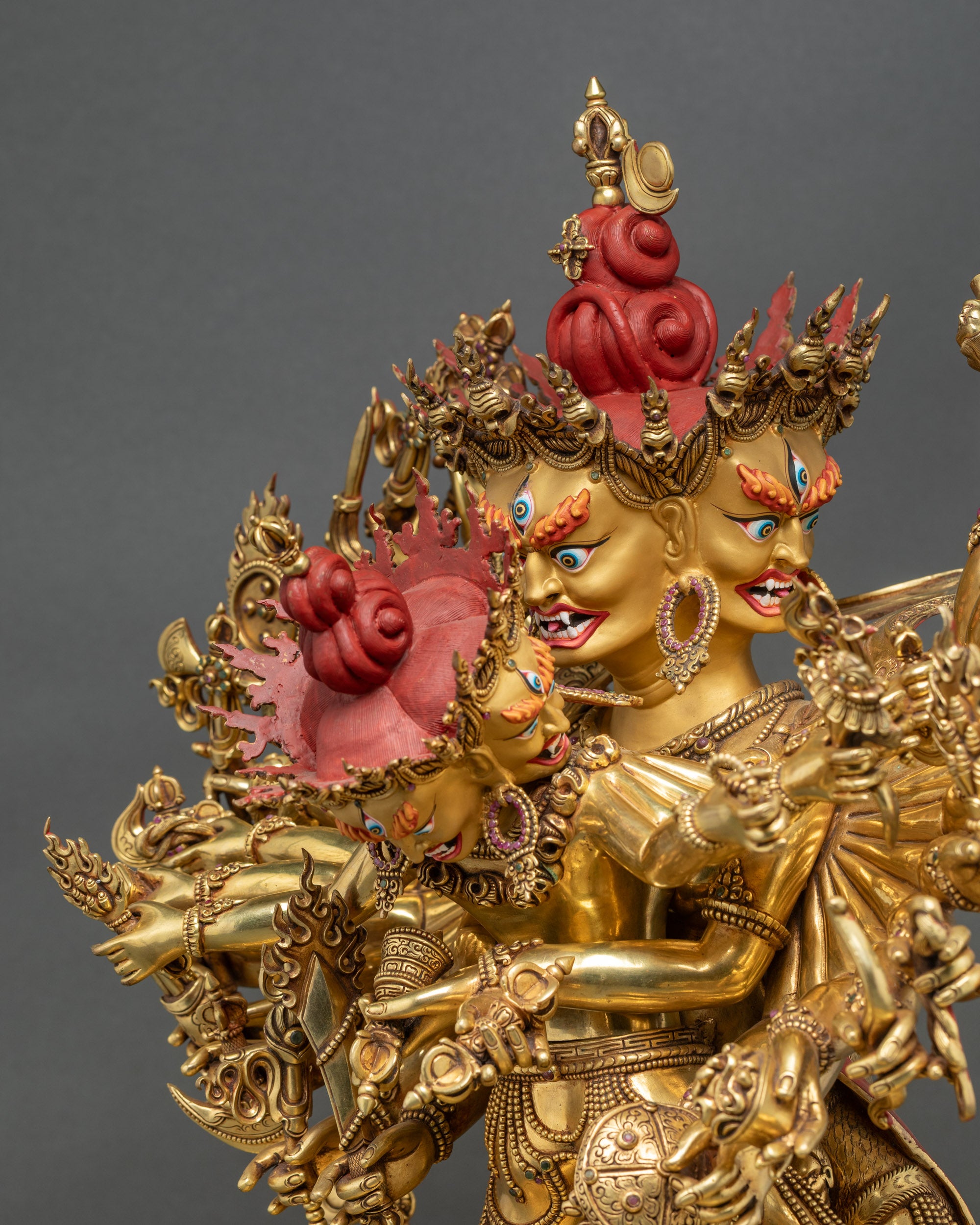 Side face close-up of Kalachakra Statue, showing intricate gold and copper work