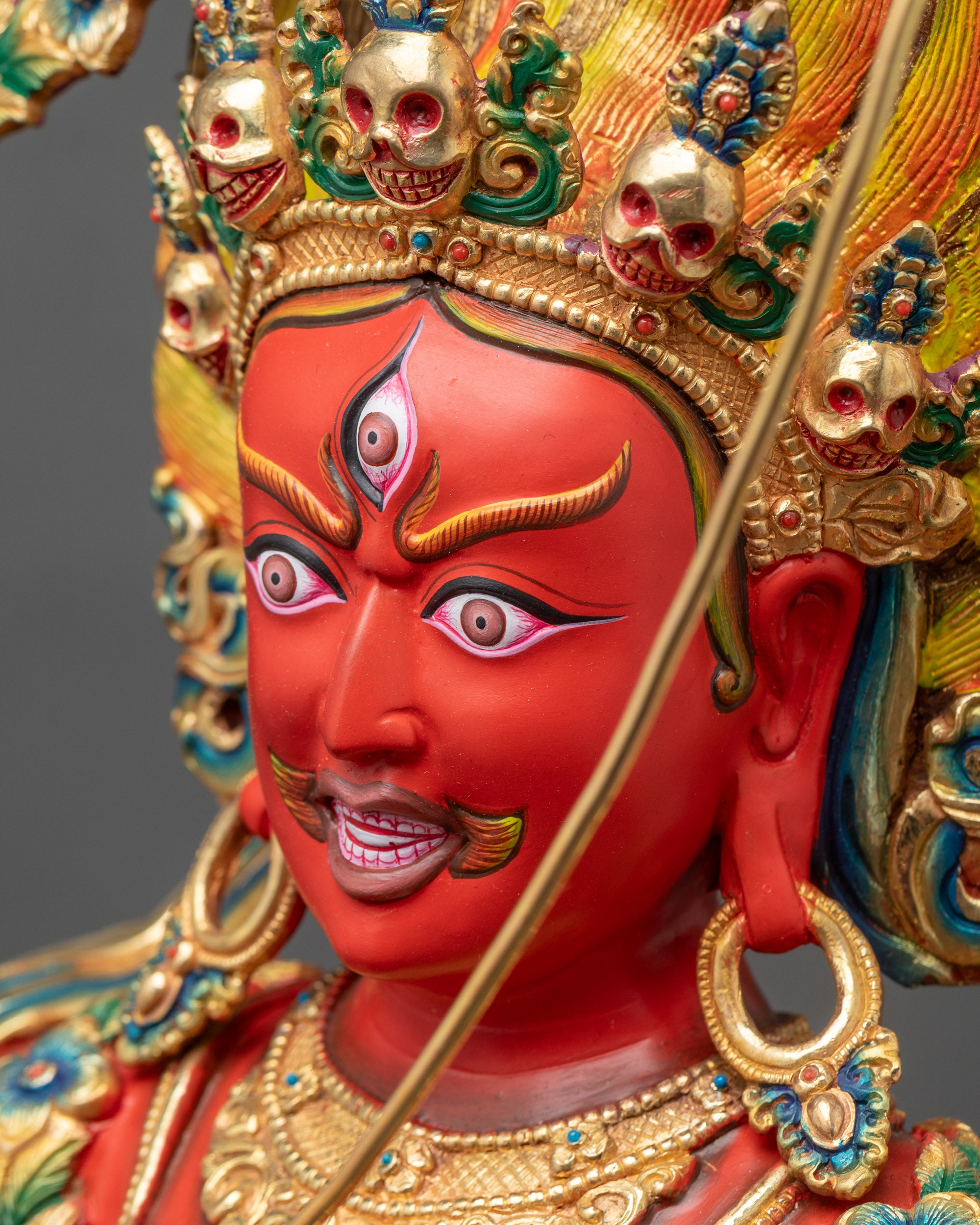 Side face close up of Kurukulla highlighting painted features and gold details