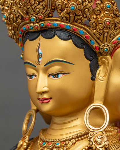 Side face close up of Ushnisha Vijaya statue with serene gold-painted expression and refined Tibetan Buddhist detailing
