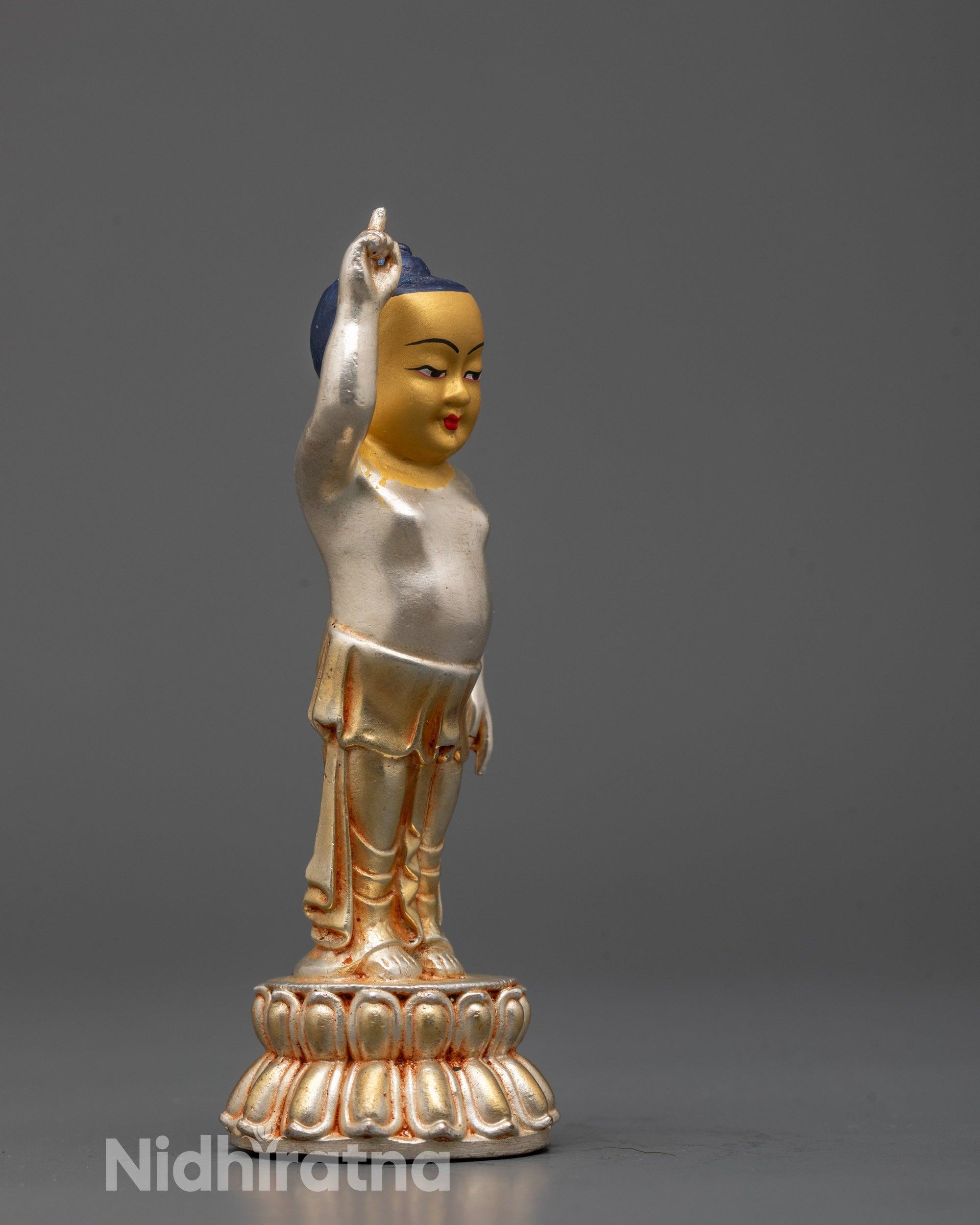 Side image of Gracefully crafted Little Buddha figurine with lotus base and radiant gold face