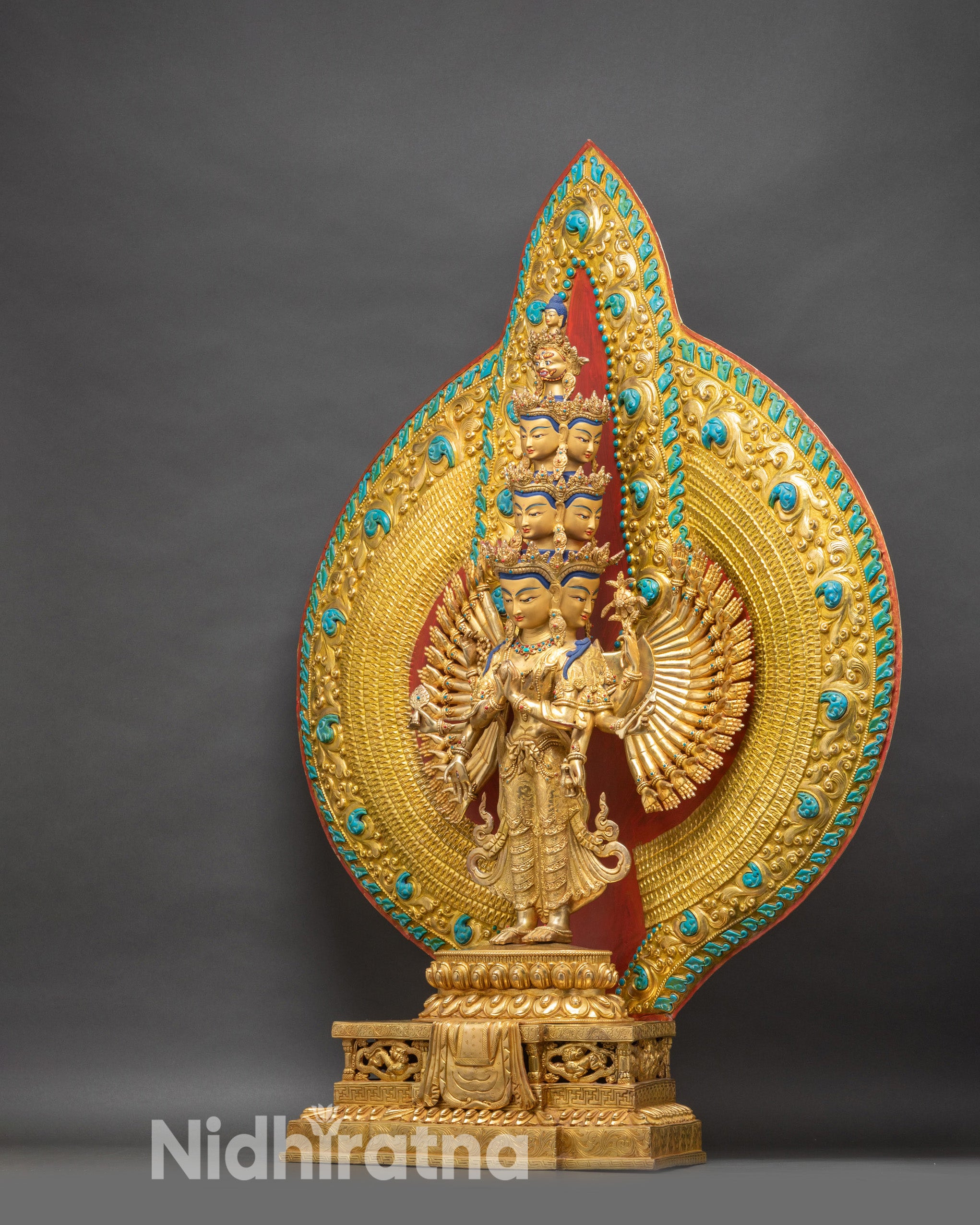 Side profile of 1000-Armed Chenrezig arms and details – copper statue with gold fire-gilded finish showcasing intricate craftsmanship.