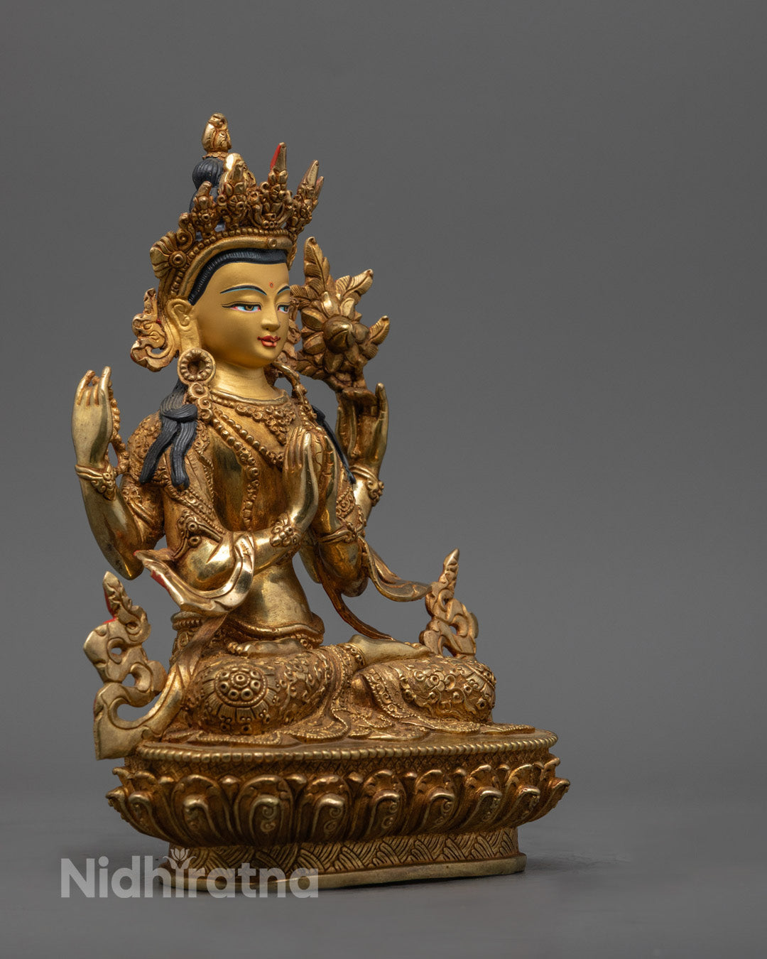 Avalokiteshvara Chenrezig Statue highlighting symbolic lotus and mala beads held in the deity’s four hands