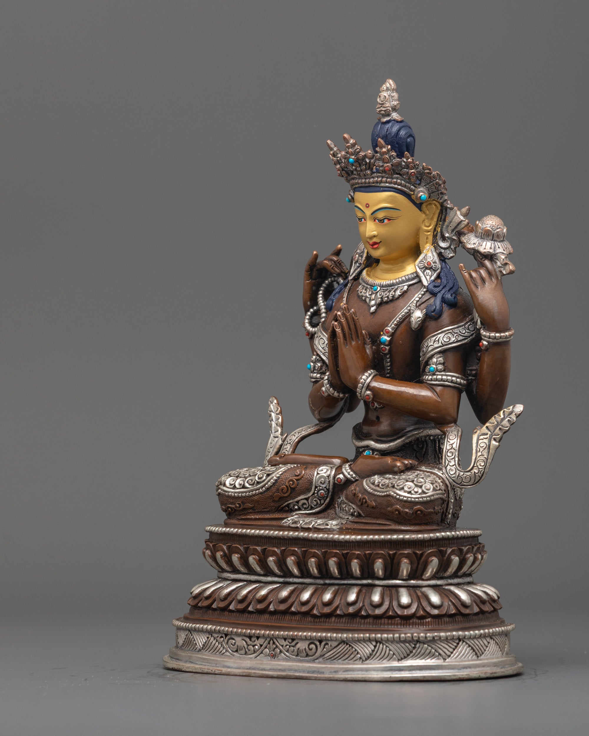 Side profile of Chenrezig statue showcasing traditional Himalayan artisan work