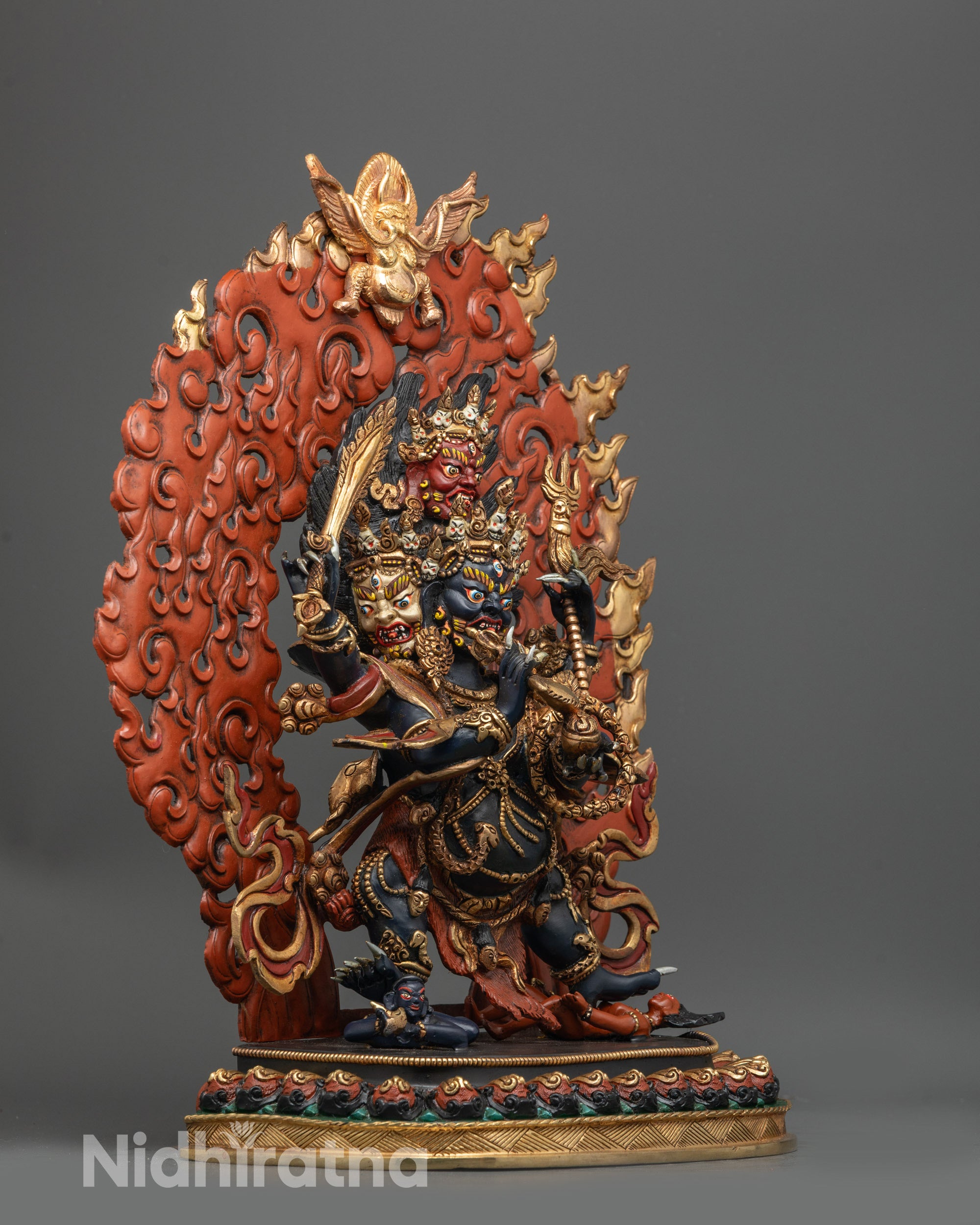 Side profile of Chuchepa Mahakala Statue showing detailed four arms