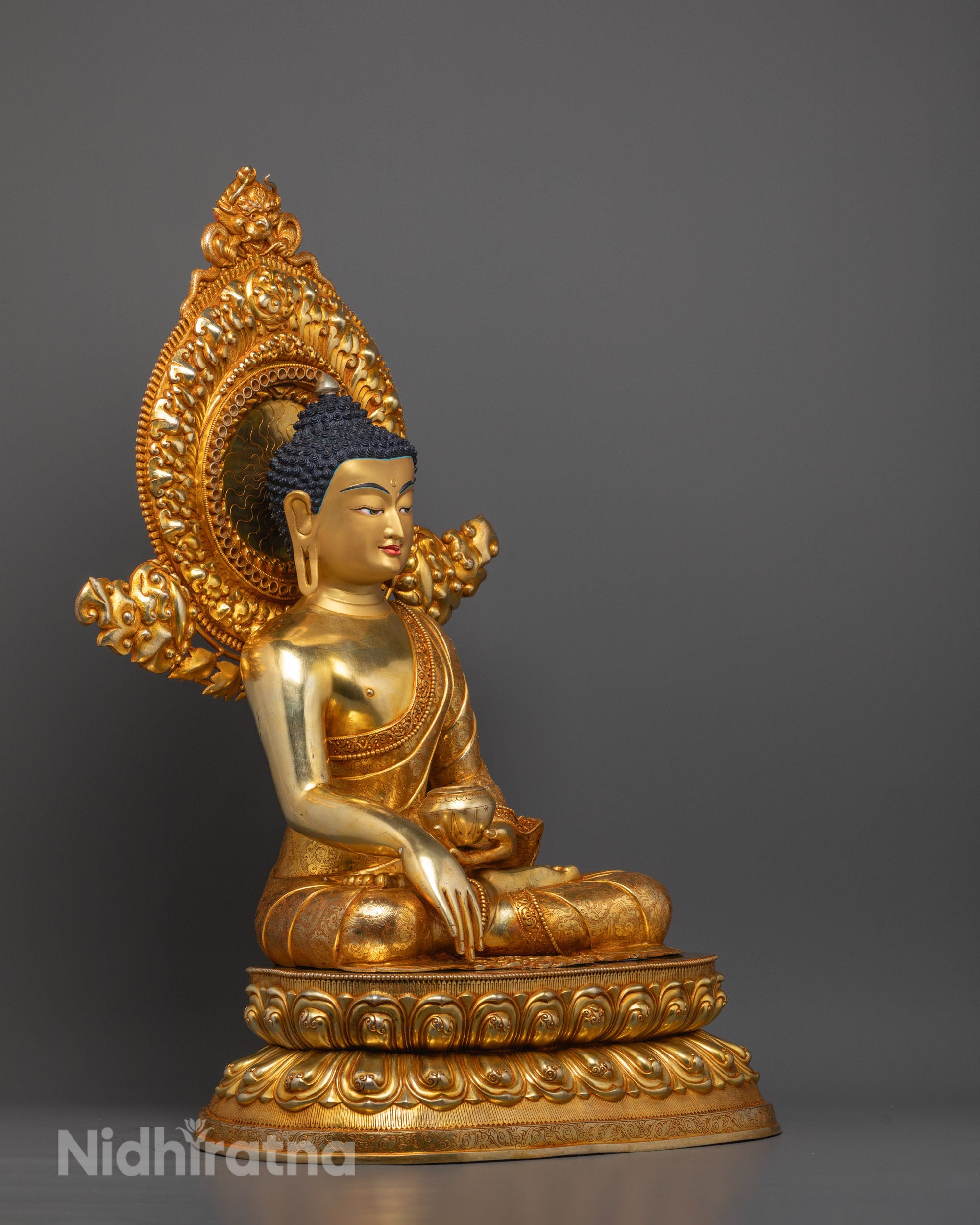 Side profile of Gold Gilded copper Shakyamuni Buddha Statue showing detailed robe folds