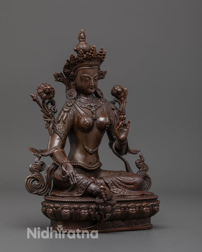 Side profile of Green Tara Sculpture showing elegant robe details