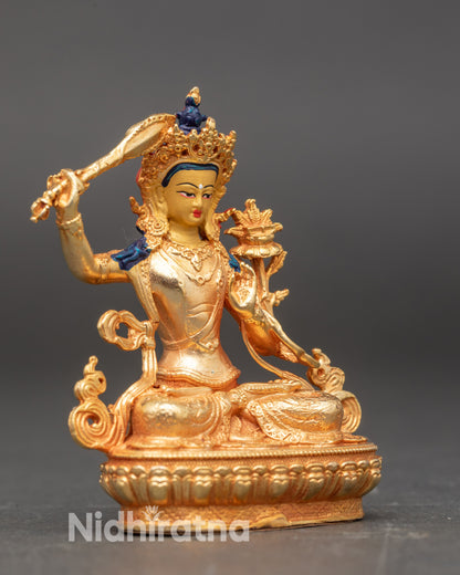 Side profile of Manjushri Bodhisattva, gold fire-gilded copper sculpture for meditation altar