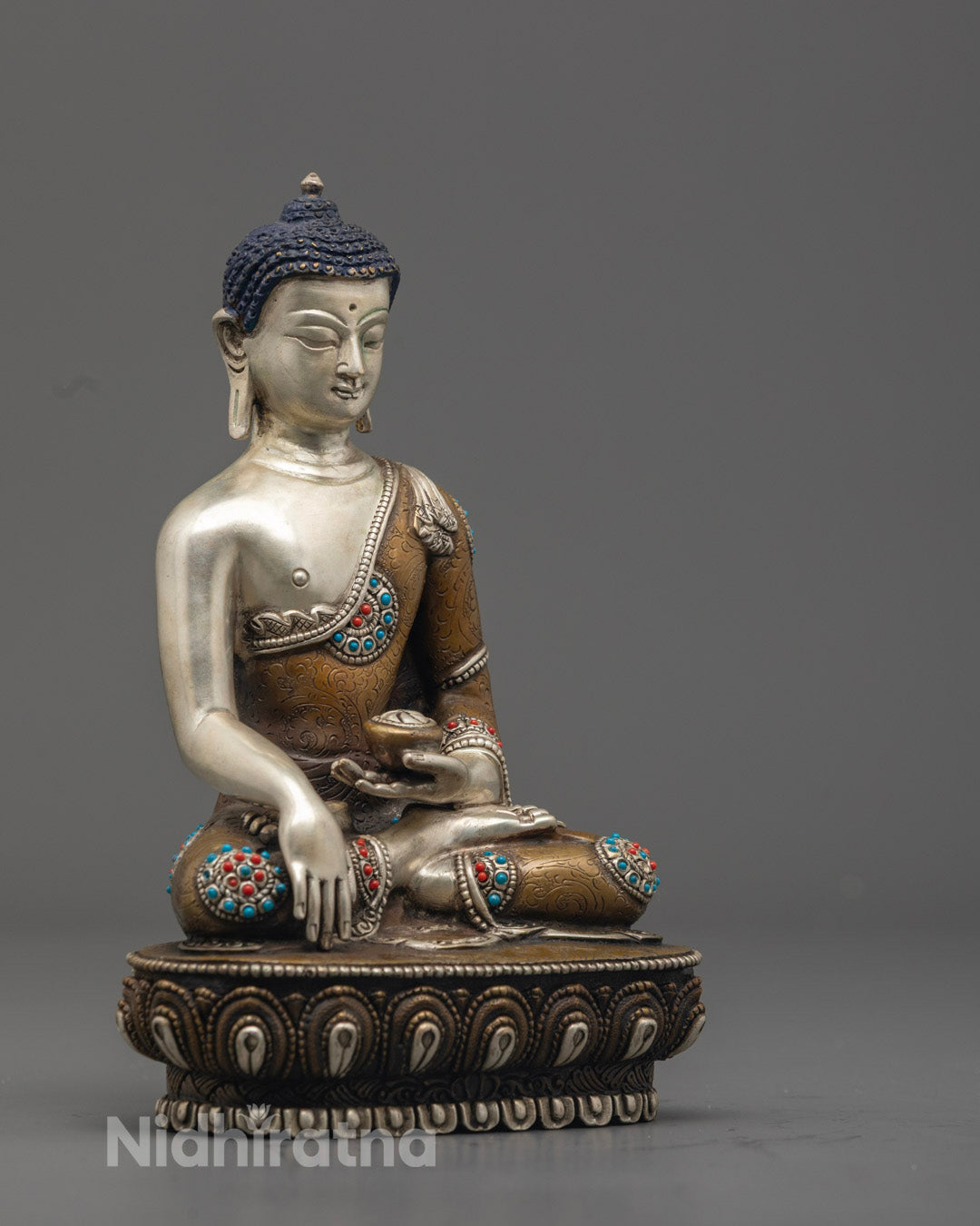 Shakyamuni Buddha sculpture, showcasing intricate acrylic colors and serene facial expression.