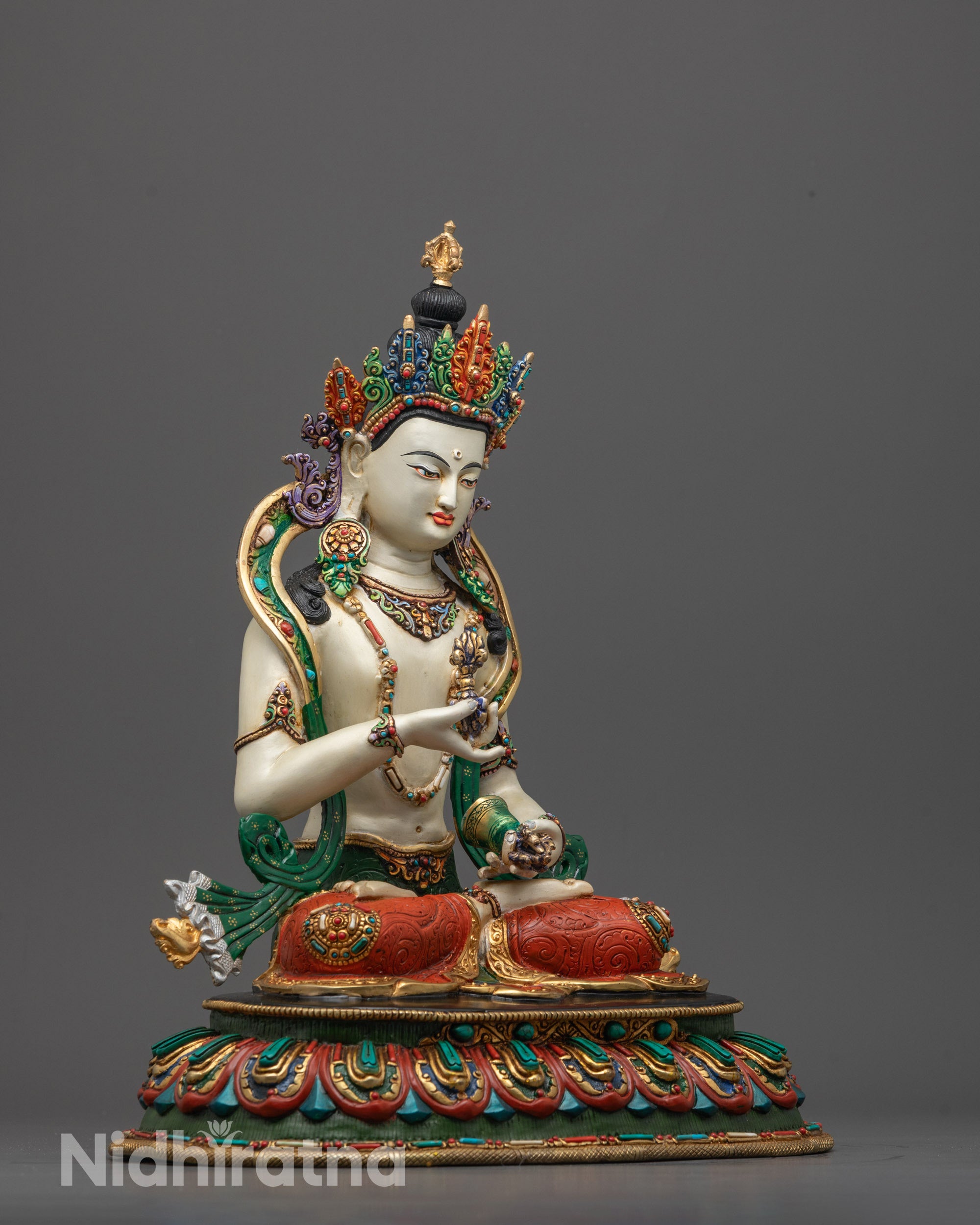 Side profile of Vajrasattva Buddha Statue with detailed robes and lotus petals