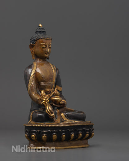 Side profile of hand-carved Medicine Buddha Statue showing intricate oxidized copper detailing