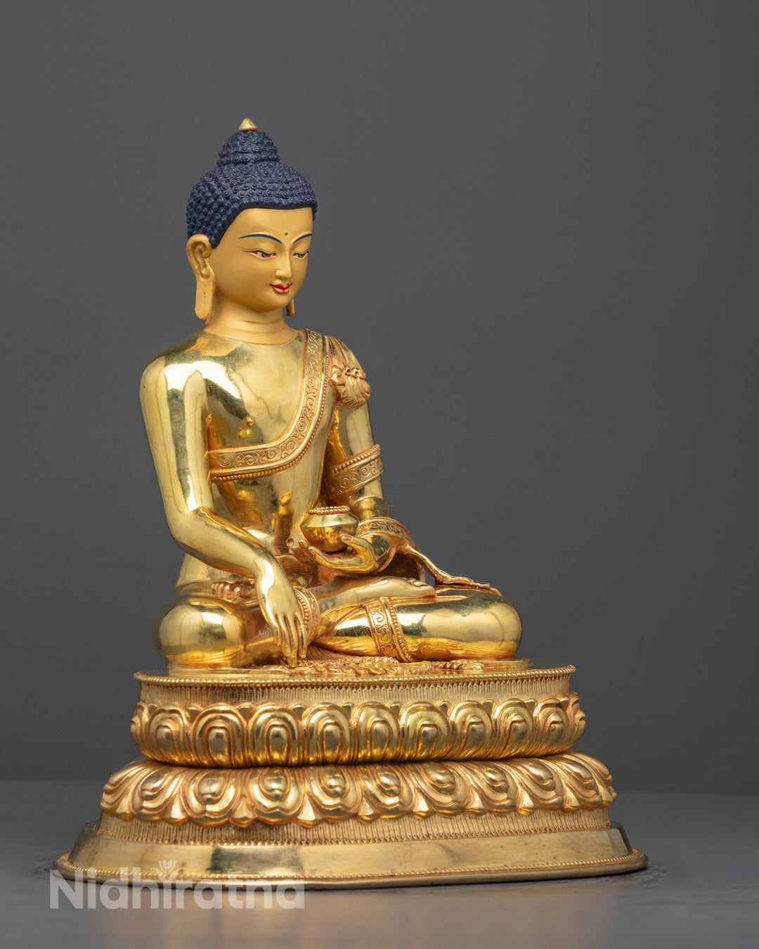 Side profile of intricately detailed Buddha statue handcrafted in Nepal.
