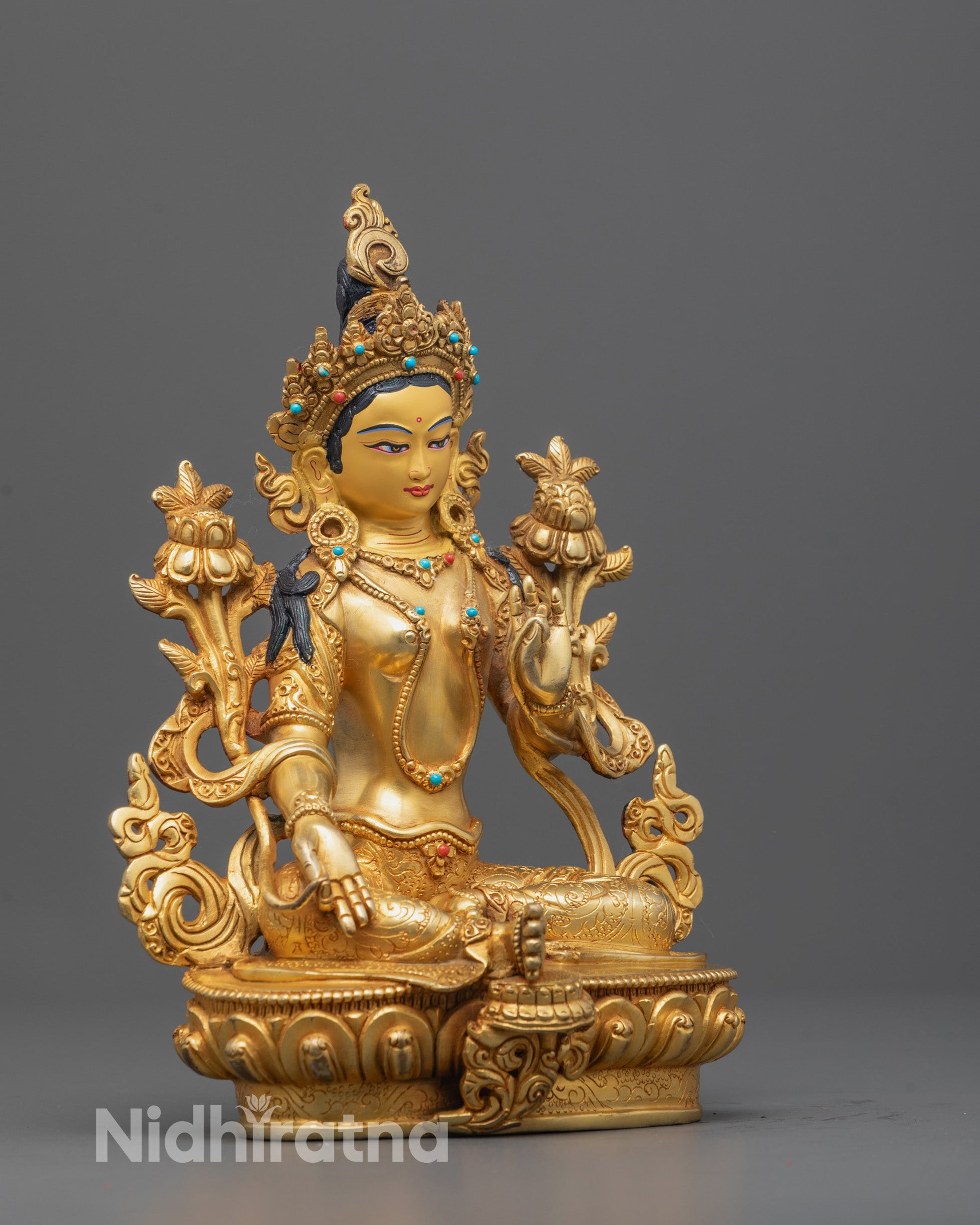 Side profile of the Green Tara Statue showing the flowing robes, graceful hand mudras