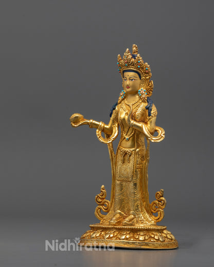 Side profile showing flowing robes and gold gilding on Mandarava and Yeshe Tsogyal figures


