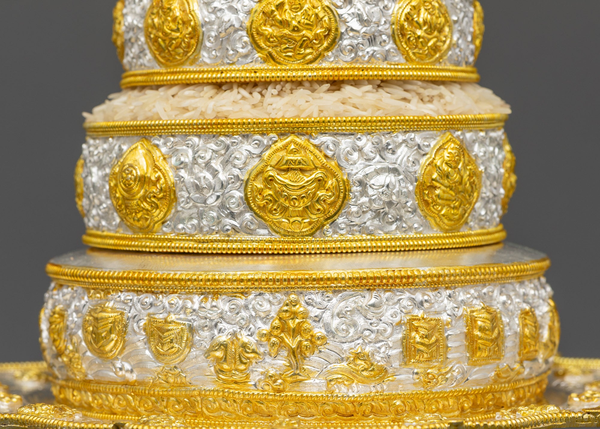 Side view 6-inch Tibetan Mandala on pedestal with layered rice offerings