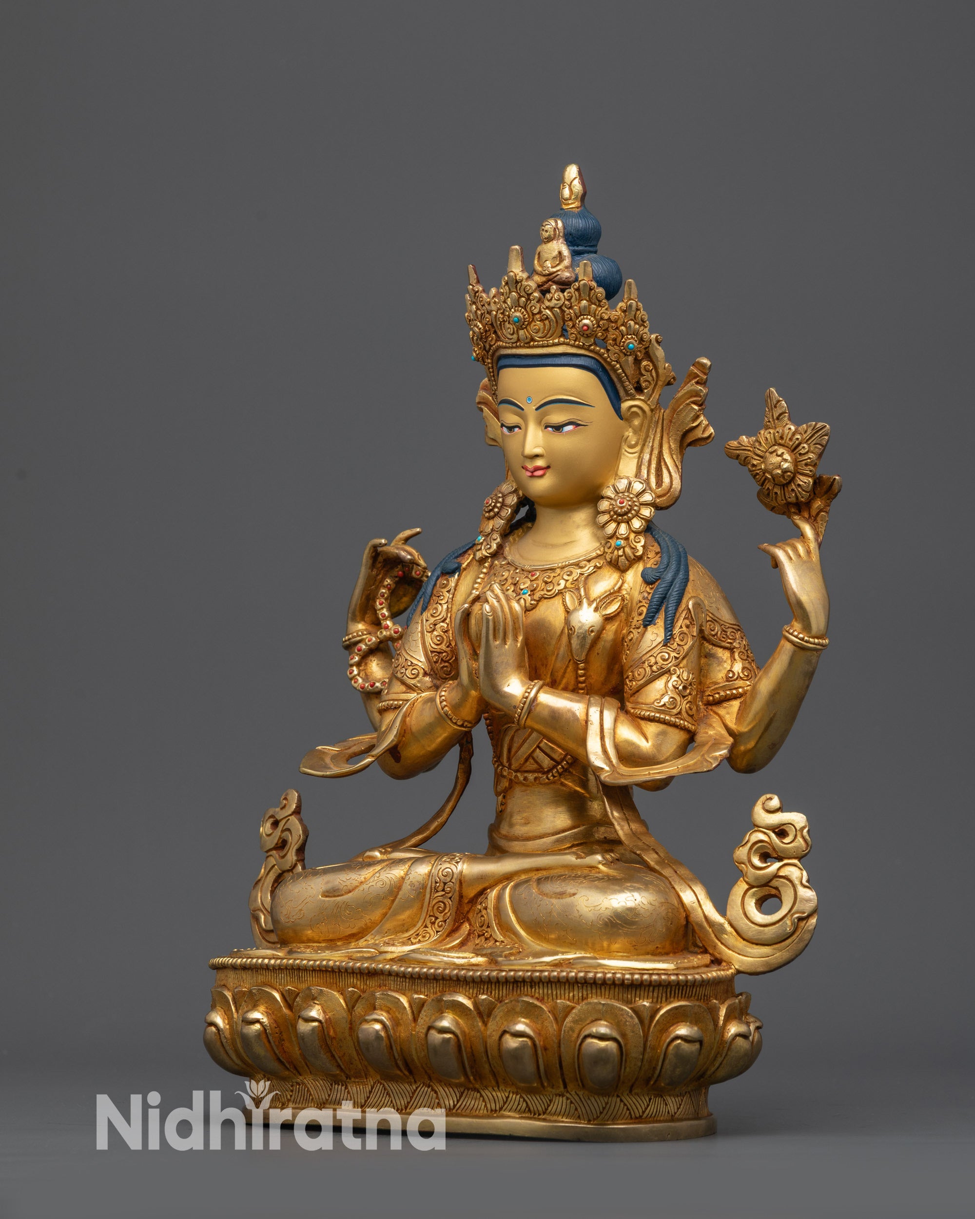 Side view Avalokiteshvara statue holding lotus and rosary with detailed carvings