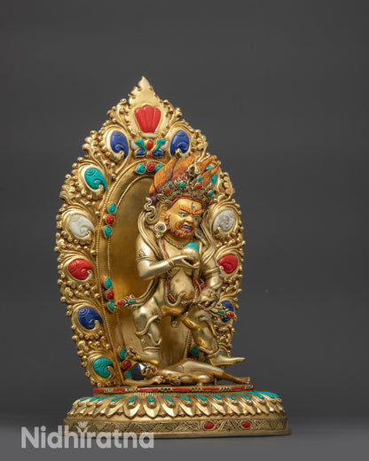 Side view Black Dzambhala Statue showing serpent ornament, skull crown, and tiger-skin robe