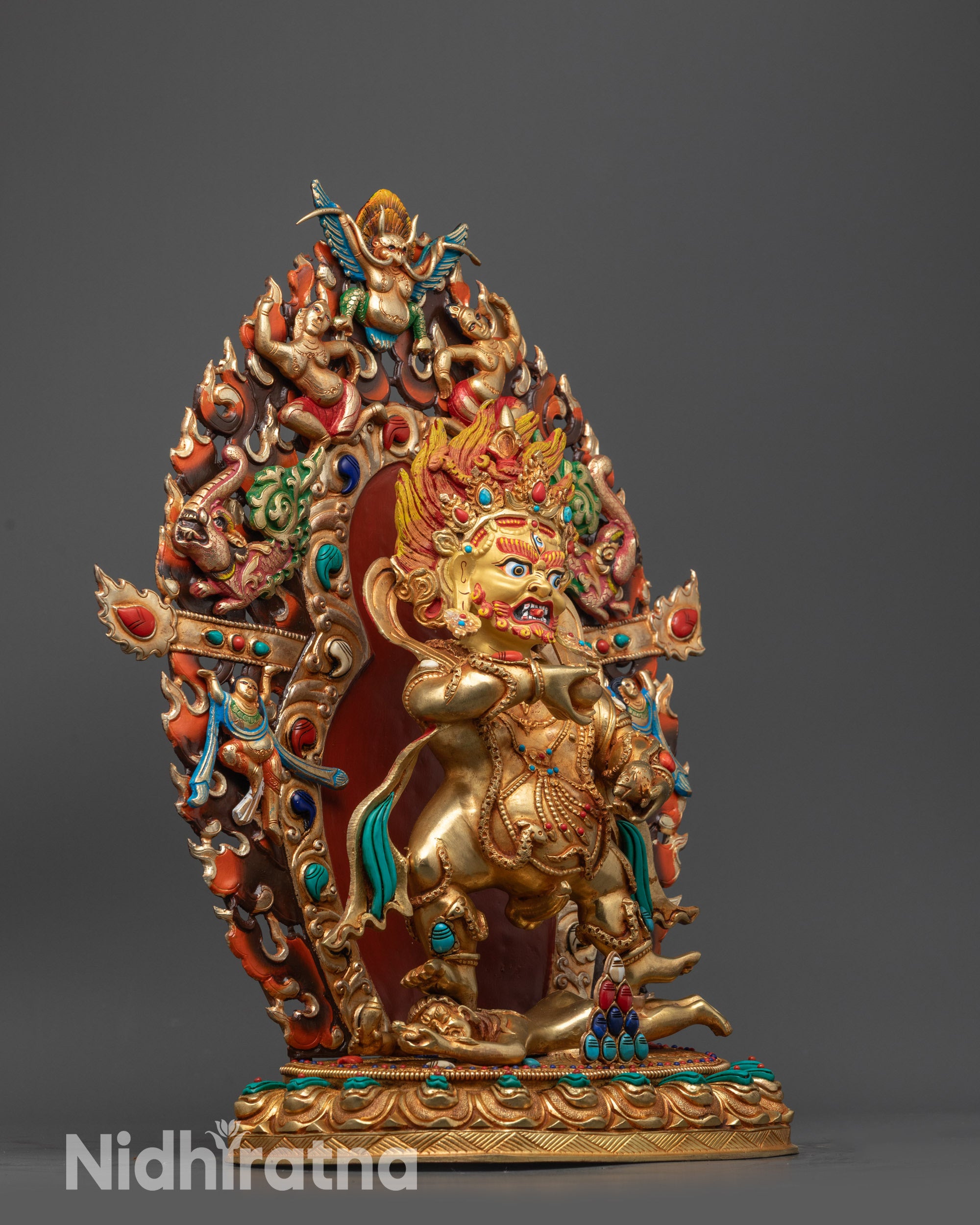 Side view Black Dzambhala with draped tiger skin, ornate jewelry, and serpent detail