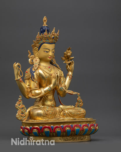 Side view Bodhisattva Chenrezig statue seated on lotus with gold-gilded decorations
