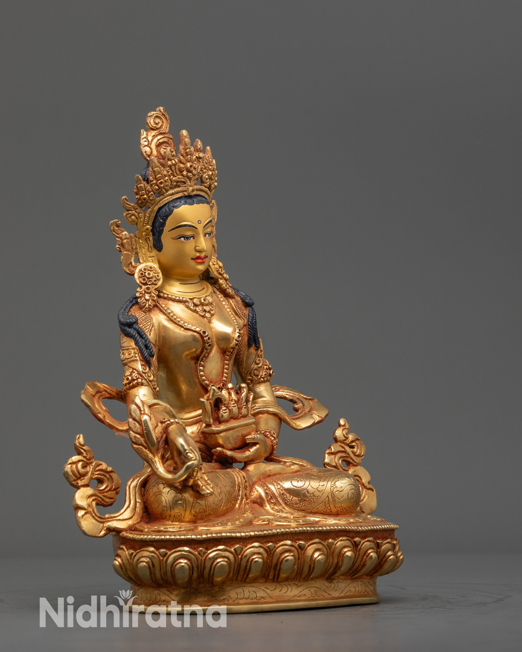 Side view Bodhisattva Ksitigarbha Statue showing flowing robes and serene lotus posture
