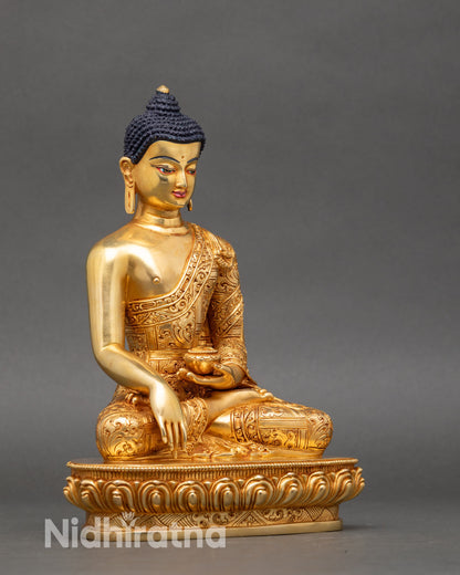 Side view Buddha statue right hand earth-touching mudra left holding patra bowl