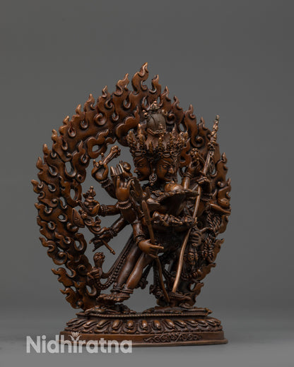 Side view Chakrasamvara statue with multiple arms holding sacred objects