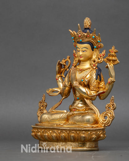 Side view Chenrezig Statue – four arms holding crystal mala, Utpala flower, and Anjali Mudra