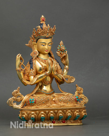 Close-up of Chenrezig face and intricate jewelry showing gold-painted details and craftsmanship