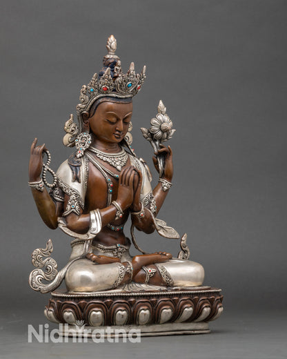 Side view Chenrezig statue – four-armed deity with crystal mala, lotus, and flowing robes