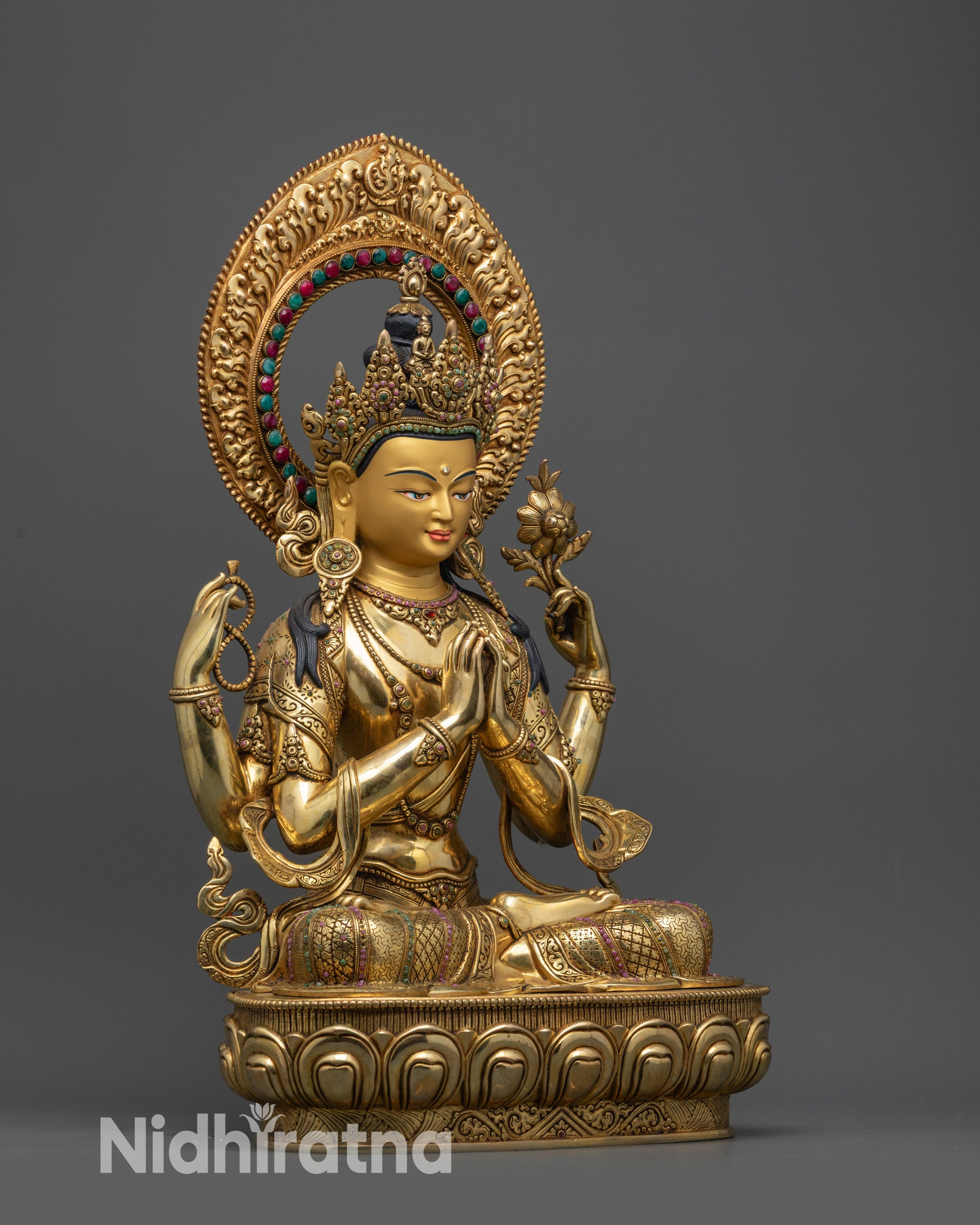 Side view Chenrezig statue seated on lotus with gold-plated copper alloy and stones

