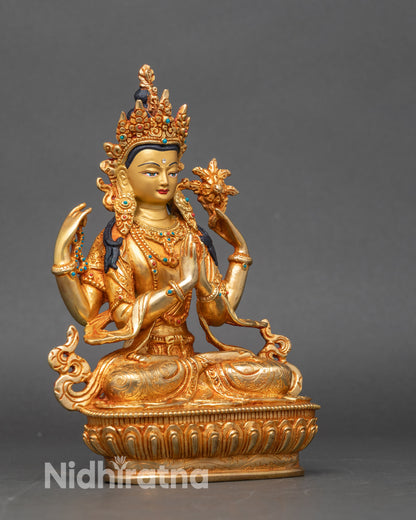 Side view Chenrezig statue showing swirling robes crystal rosary and lotus flower