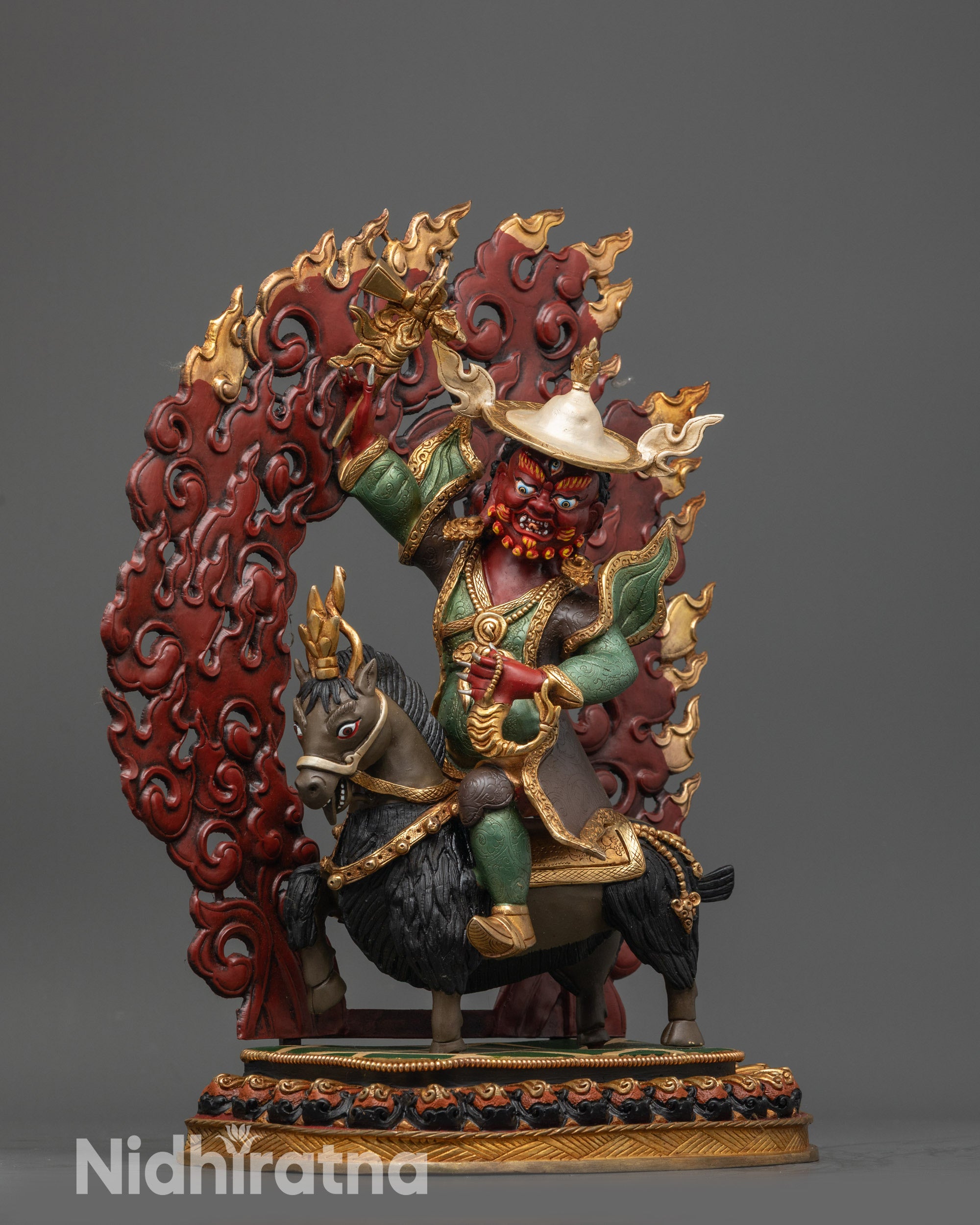 Side view Damchen Garwa Nagpo holding hammer staff and rosary
