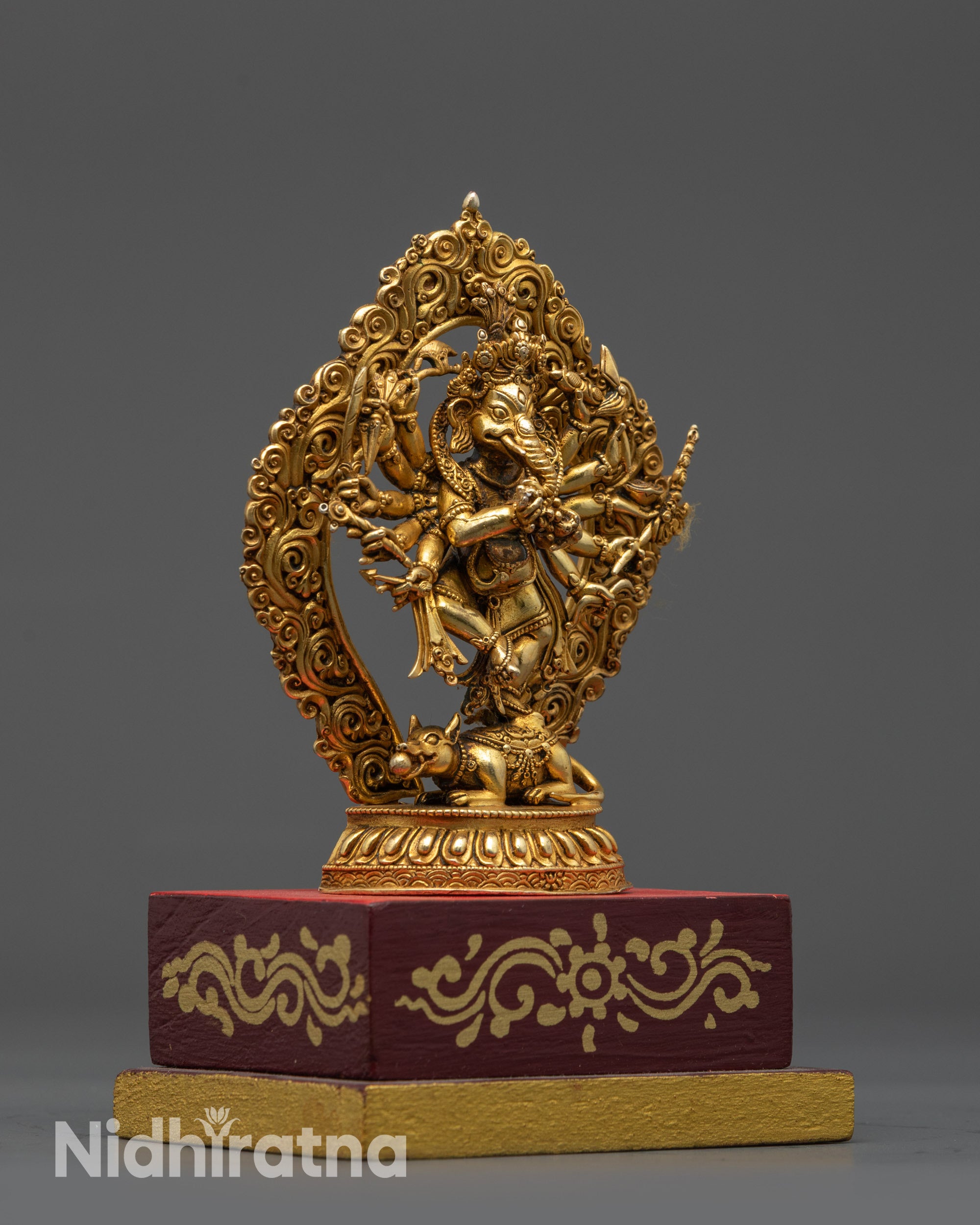 Side view Dancing Ganesh on Mushika with halo and serpent detail