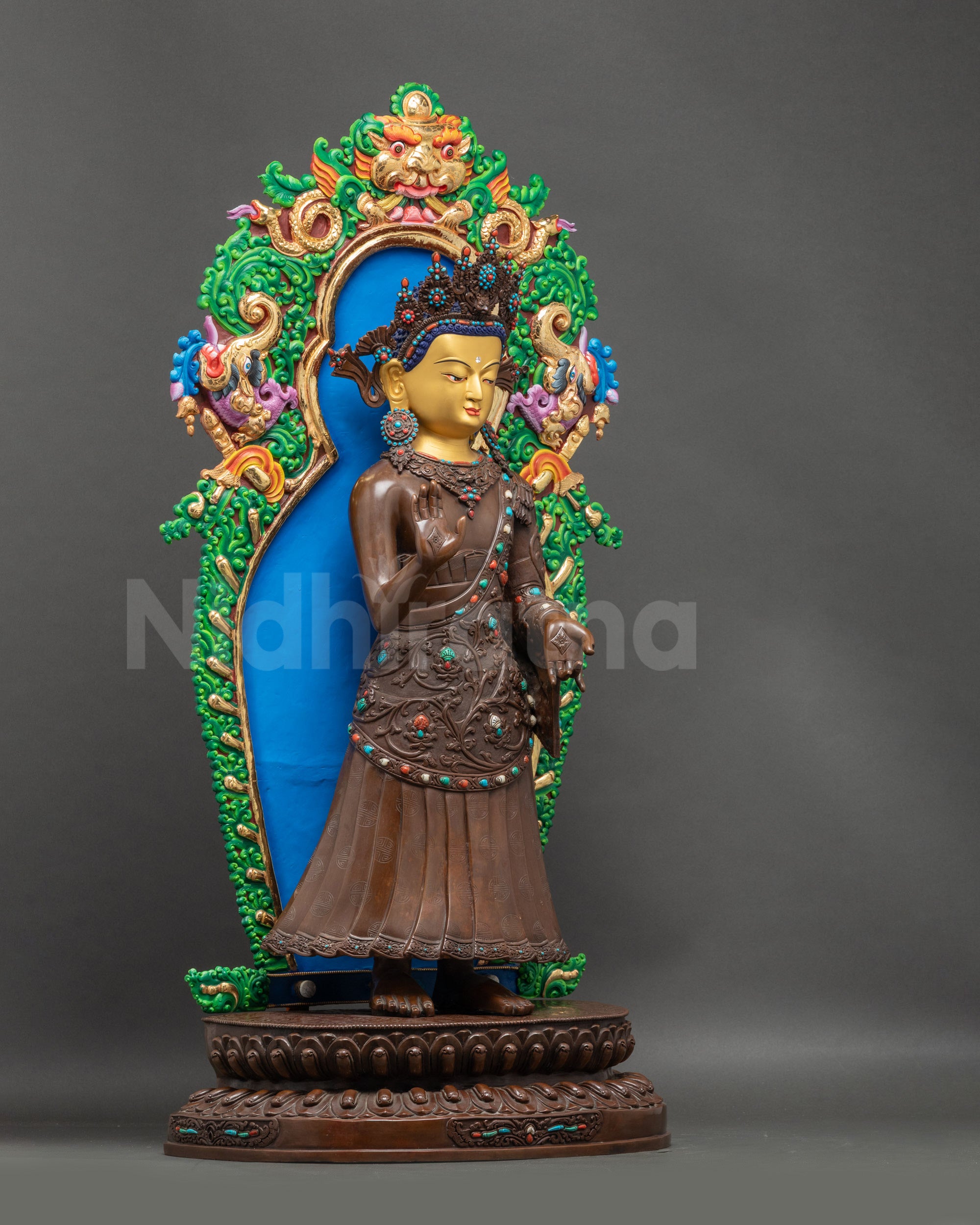 Side view Dipankara Buddha statue adorned with semi-precious stones, Himalayan artistry